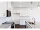 Kitchen with white cabinets, granite countertops, stainless appliances, subway tile backsplash, and pendant lighting at 22 Twin Birch Dr, Angier, NC 27501