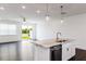 Kitchen island with stainless dishwasher and granite countertops at 22 Twin Birch Dr, Angier, NC 27501