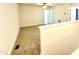 An upstairs loft space features fresh white paint, carpet flooring, and a railing overlooking the level below at 22 Twin Birch Dr, Angier, NC 27501