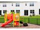 Colorful playground on a lot with a chain link fence at 22 Twin Birch Dr, Angier, NC 27501