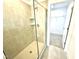 A modern shower features tiled walls, a glass door, and sleek fixtures at 22 Twin Birch Dr, Angier, NC 27501