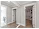 Hallway with carpet, mirrored wall and access to the walk-in closet with ample space at 243 Augusta Pond Way # 163, Raleigh, NC 27603