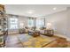 Cozy living room with a neutral color palette, a plush sofa, and natural light streaming through the windows at 243 Augusta Pond Way # 163, Raleigh, NC 27603