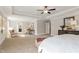 Spacious main bedroom featuring a tray ceiling, sitting area, and ensuite bathroom with natural light at 243 Augusta Pond Way # 163, Raleigh, NC 27603