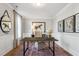 Elegant home office with wainscoting, a large desk, and sophisticated decor for a productive workspace at 243 Augusta Pond Way # 163, Raleigh, NC 27603
