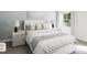 Bedroom features a large bed, bedside tables with lamps, and soft neutral accents at 269 Beacon Dr, Pittsboro, NC 27312