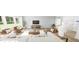 Bright living room with modern furniture, large windows, and hardwood floors at 269 Beacon Dr, Pittsboro, NC 27312