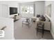Open-concept living room with stylish decor, plush seating, and plenty of natural light at 269 Beacon Dr, Pittsboro, NC 27312