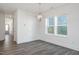 Bright dining area with large windows, modern lighting and neutral decor, perfect for comfortable gatherings at 272 Beacon Dr, Pittsboro, NC 27312