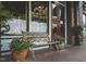 Charming soda shop exterior with a bench in front and decorative plants, welcoming visitors to relax and enjoy at 272 Beacon Dr, Pittsboro, NC 27312
