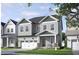 Charming two-story home with gray siding, covered porch, and attached two-car garage at 280 Beacon Dr, Pittsboro, NC 27312