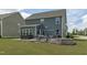 Beautiful backyard with a hot tub, outdoor dining, and fire pit, great for relaxation and gatherings at 2801 Landon Ridge Dr, New Hill, NC 27562