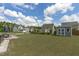 Spacious backyard featuring a storage shed, manicured lawn, and neighborhood view at 2801 Landon Ridge Dr, New Hill, NC 27562