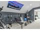 Home gym with Patagonia banner, weightlifting equipment, and space for cardio at 2801 Landon Ridge Dr, New Hill, NC 27562