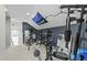 Brightly lit home gym featuring various weightlifting and cardio equipment at 2801 Landon Ridge Dr, New Hill, NC 27562