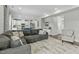 Open-concept living area connecting the kitchen and living room with a large sectional sofa at 2801 Landon Ridge Dr, New Hill, NC 27562