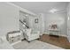 Inviting living room area featuring a comfy armchair and a decorative console table at 2801 Landon Ridge Dr, New Hill, NC 27562