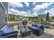 Backyard stone patio featuring comfortable seating, and view of neighborhood at 2801 Landon Ridge Dr, New Hill, NC 27562