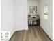 Inviting entryway featuring hardwood floors, a console table with decor, and natural light at 293 Beacon Dr, Pittsboro, NC 27312