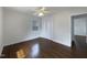 Bedroom featuring hardwood floors, a window, and a closet for ample storage at 300 Perry St, Rolesville, NC 27571