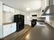 Kitchen with white cabinets, black appliances and updated fixtures at 300 Perry St, Rolesville, NC 27571
