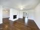 Spacious living room with hardwood floors and a cozy brick fireplace at 300 Perry St, Rolesville, NC 27571