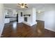 Open floor plan connecting the living room with a charming fireplace to the well-lit kitchen at 300 Perry St, Rolesville, NC 27571