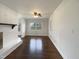 Bright living room with hardwood floors, fireplace, and ample light from the large windows at 300 Perry St, Rolesville, NC 27571