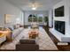 Bright living room with a cozy fireplace, large windows, and stylish decor at 300 Perry St, Rolesville, NC 27571