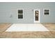 New home back patio in backyard with door and windows at 316 Hopewell Branch Ct, Smithfield, NC 27577