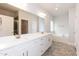 Primary bathroom features a double vanity, a large mirror, a separate shower, and a soaking tub at 316 Hopewell Branch Ct, Smithfield, NC 27577