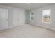 Well-lit bedroom with carpet, neutral paint, with large windows at 316 Hopewell Branch Ct, Smithfield, NC 27577