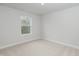 Bright bedroom featuring neutral carpet and paint, creating a serene atmosphere at 316 Hopewell Branch Ct, Smithfield, NC 27577