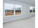Living room with large windows providing natural light and views of the outdoors at 316 Hopewell Branch Ct, Smithfield, NC 27577