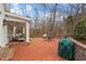 Expansive backyard patio with brick pavers and various seating arrangements at 321 Nottingham Dr, Chapel Hill, NC 27517