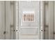 Bathroom with free standing tub, decorative chandelier, and neutral color palette at 321 Nottingham Dr, Chapel Hill, NC 27517