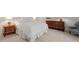 Classic bedroom with white linens, wood furniture, and soft carpet flooring at 321 Nottingham Dr, Chapel Hill, NC 27517