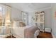 Comfortable bedroom featuring hardwood floors, bright windows, and white trim at 321 Nottingham Dr, Chapel Hill, NC 27517
