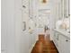 Spacious butler's pantry featuring ample custom storage, glass-front cabinets, marble counters, and elegant design at 321 Nottingham Dr, Chapel Hill, NC 27517