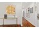 Foyer showcasing hardwood floors, a stylish console table, and elegant wall art at 321 Nottingham Dr, Chapel Hill, NC 27517