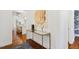 Entryway featuring hardwood floors, a mirrored console table, and decorative floral artwork at 321 Nottingham Dr, Chapel Hill, NC 27517