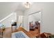 Bright hallway with hardwood floors and an open doorway to a cozy seating area at 321 Nottingham Dr, Chapel Hill, NC 27517