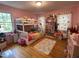 Adorable bedroom featuring a bunk bed and a decorative floral curtain at 321 Willowood Dr, Henderson, NC 27536