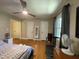 Bedroom with hardwood floors, natural light, two closets, and a stationary bike at 321 Willowood Dr, Henderson, NC 27536