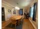 Bright dining room with a wooden table, chandelier lighting, and hardwood floors at 321 Willowood Dr, Henderson, NC 27536