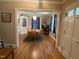 Elegant dining room featuring hardwood floors and stylish chandelier lighting at 321 Willowood Dr, Henderson, NC 27536
