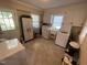 Bright laundry room featuring a washer, dryer and ample storage space at 321 Willowood Dr, Henderson, NC 27536