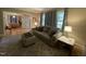 Cozy living room with a large sofa, accent pillows, and ample natural light at 321 Willowood Dr, Henderson, NC 27536