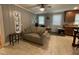 Relaxing living room with a comfortable sofa, natural lighting, and neutral tones at 321 Willowood Dr, Henderson, NC 27536