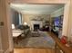 Comfortable living room with a fireplace, soft lighting, and stylish decor at 321 Willowood Dr, Henderson, NC 27536